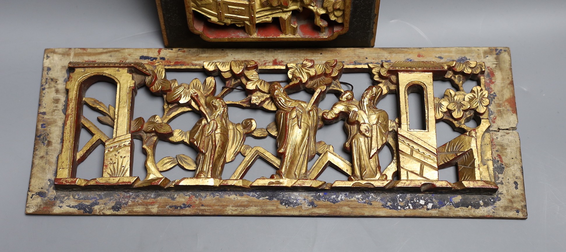 Two Chinese carved giltwood panels, widest 35 cms